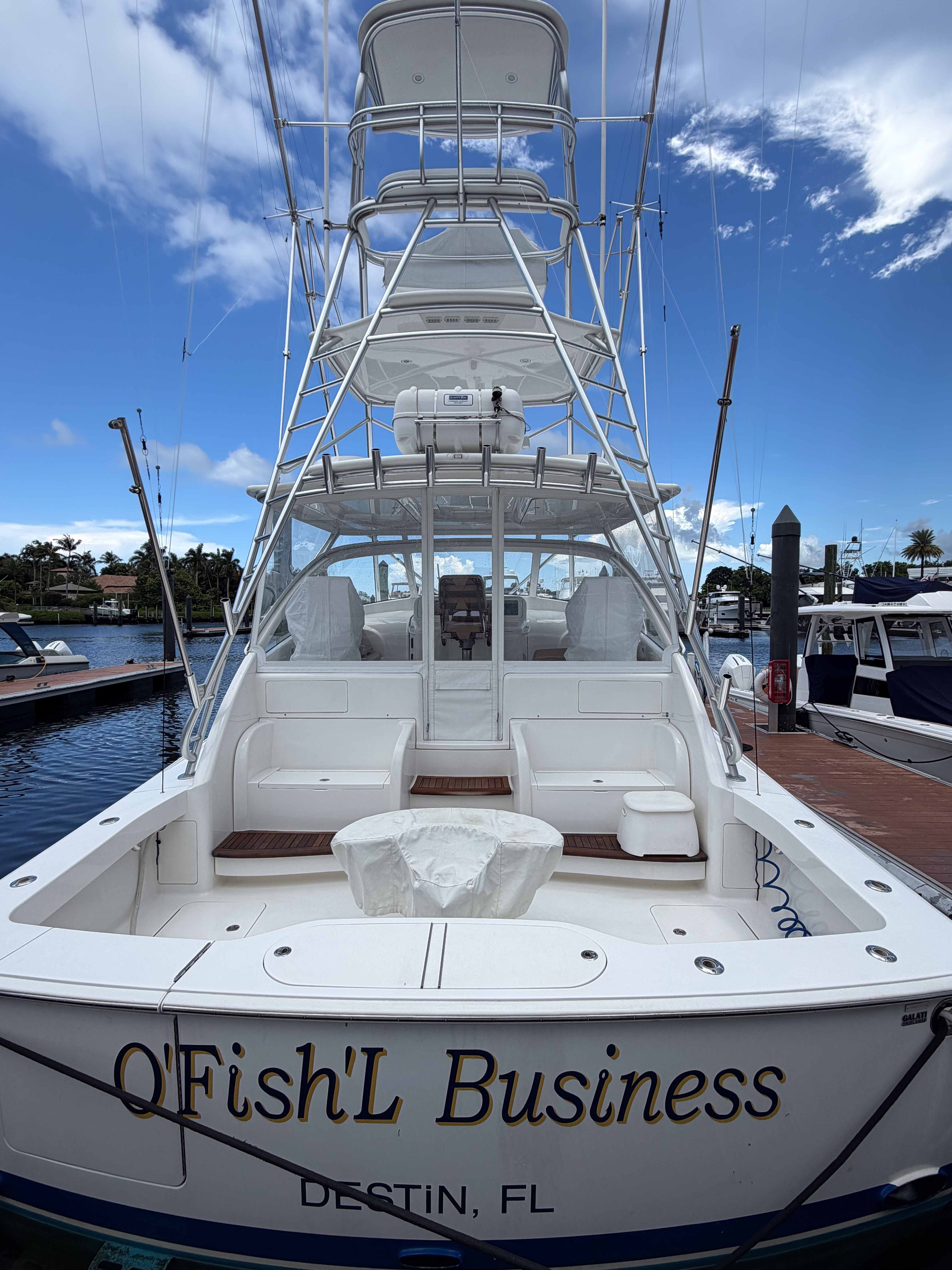 Clean yacht bow and deck in a tropical residential setting